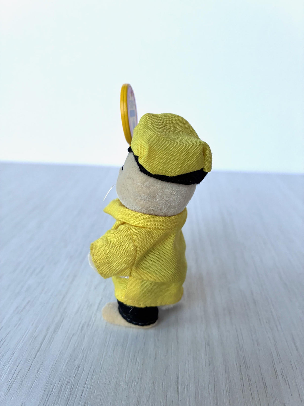 Side view of the Calico Critters Lollipop Man cat with STOP sign, vintage Sylvanian Families school figure