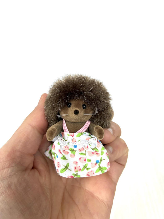 Calico Critters Sylvanian Families Pickleweeds Bramble hedgehog sister in white floral dress, front view
