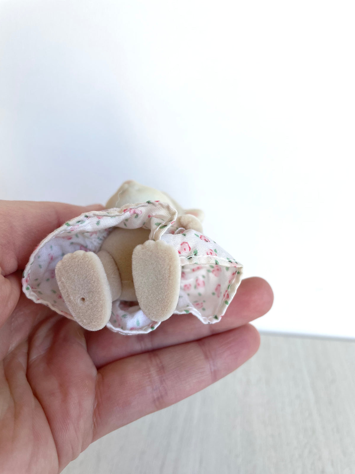 Underside of the Calico Critters Sylvanian Families sheep girl showing feet and dress lining, condition detail