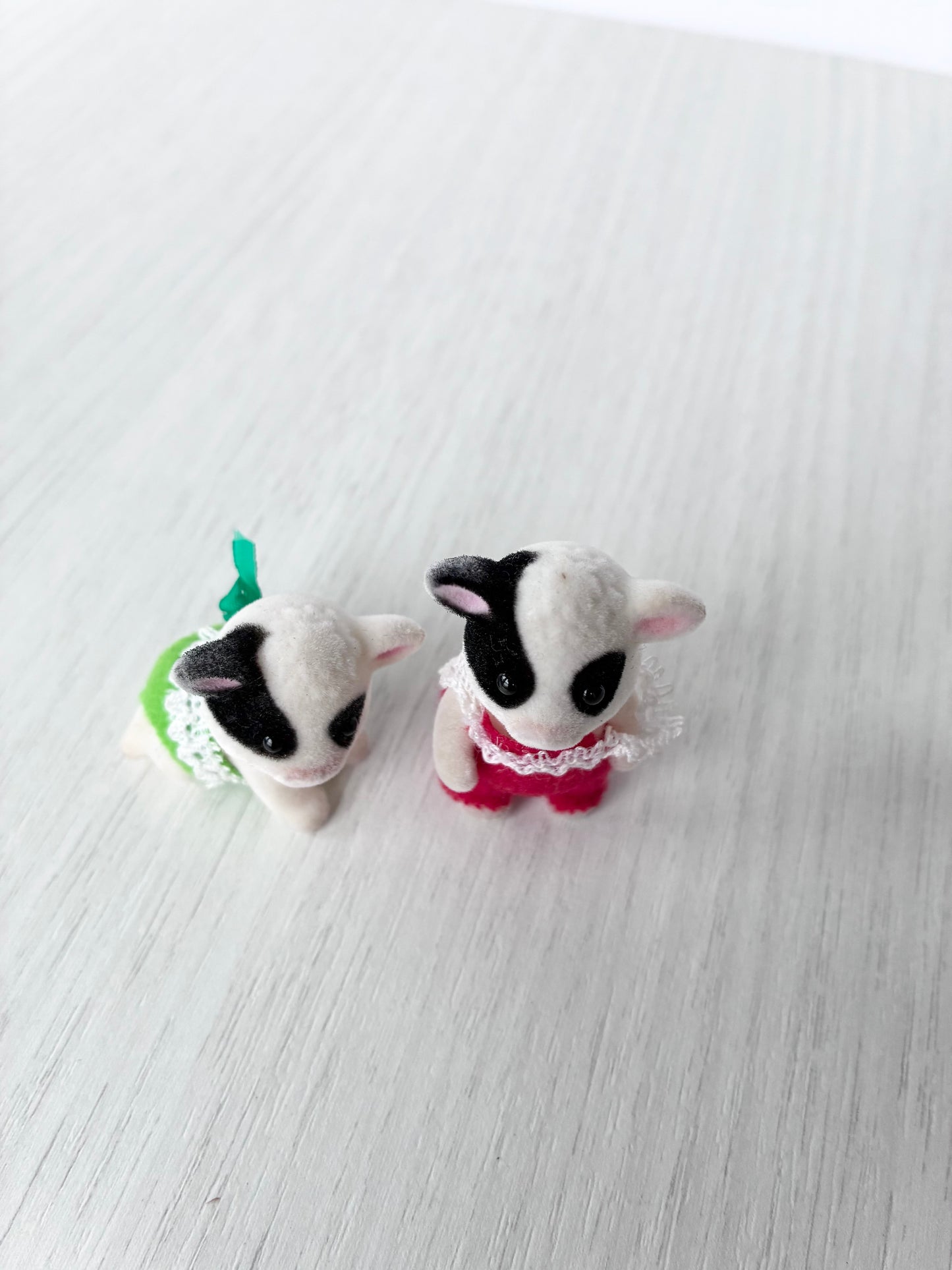 Calico Critters Sylvanian Families Buttercup Friesian cow twin babies together, standing articulated pose and crawling pose side by side