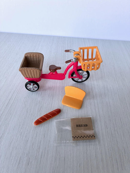Sylvanian Families Calico Critters red bicycle with orange front basket, rear basket, child seat, baguette and bread bag – photo 1 of 8