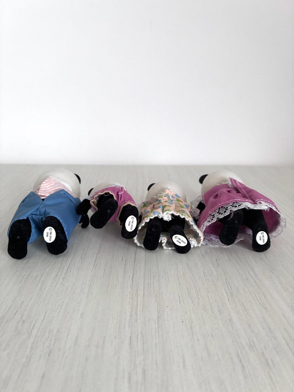 Calico Critters Sylvanian Families vintage Bamboo Panda family of 4, base view in hand showing 1985 Epoch China stamp stickers