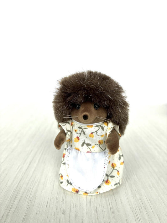 Calico Critters Sylvanian Families Pickleweeds Bramble hedgehog mother in white floral dress, front view standing
