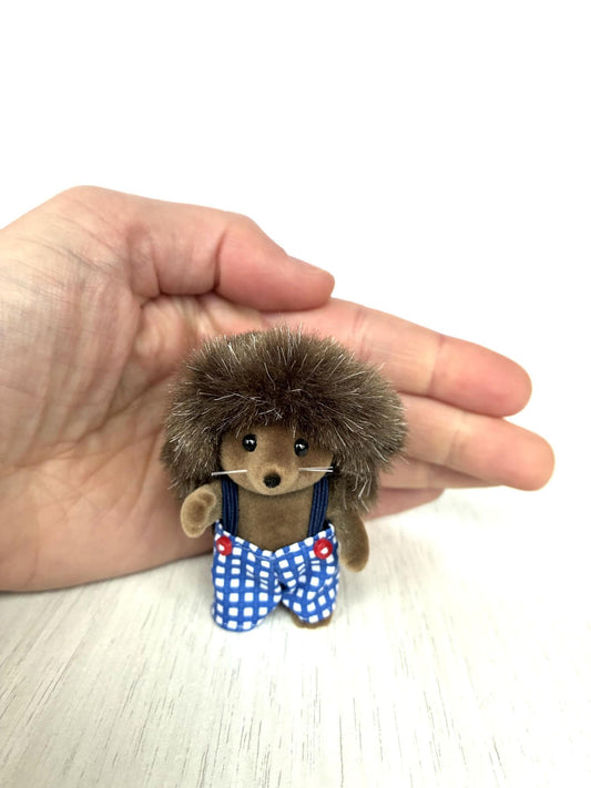 Calico Critters Sylvanian Families Pickleweeds Bramble hedgehog brother in blue gingham dungarees, front view