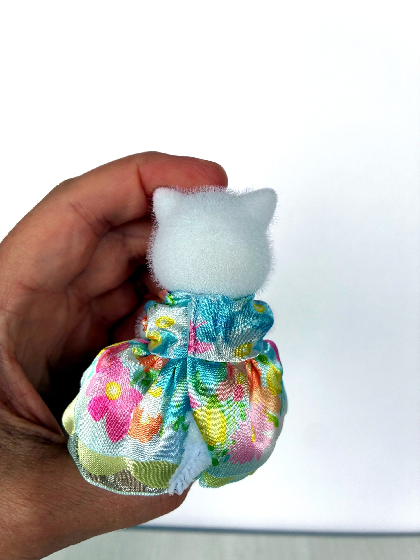 Back view of rainbow flower princess dress on Persian Cat girl