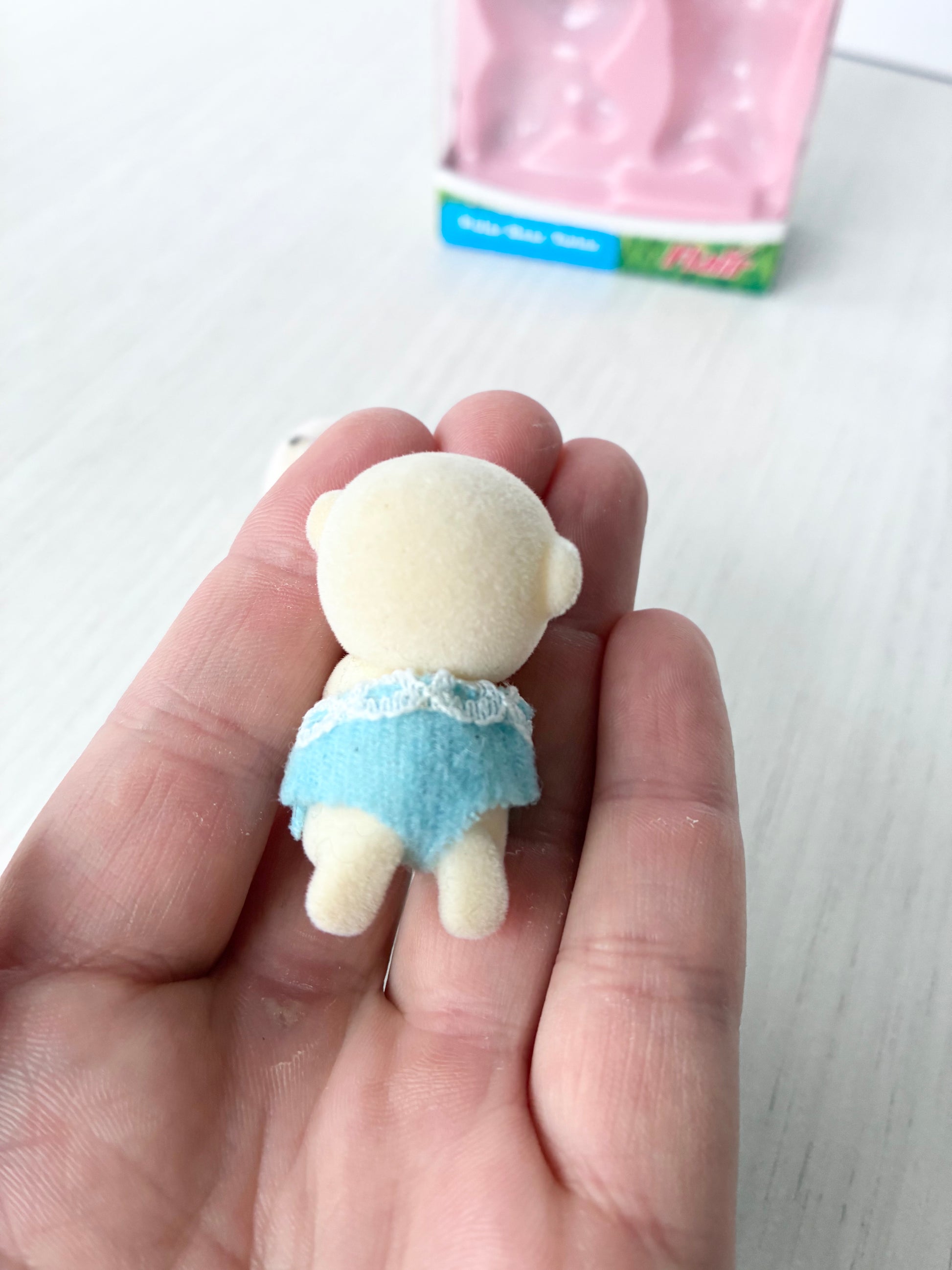 Calico Critters Sylvanian Families polar bear baby in blue, side view