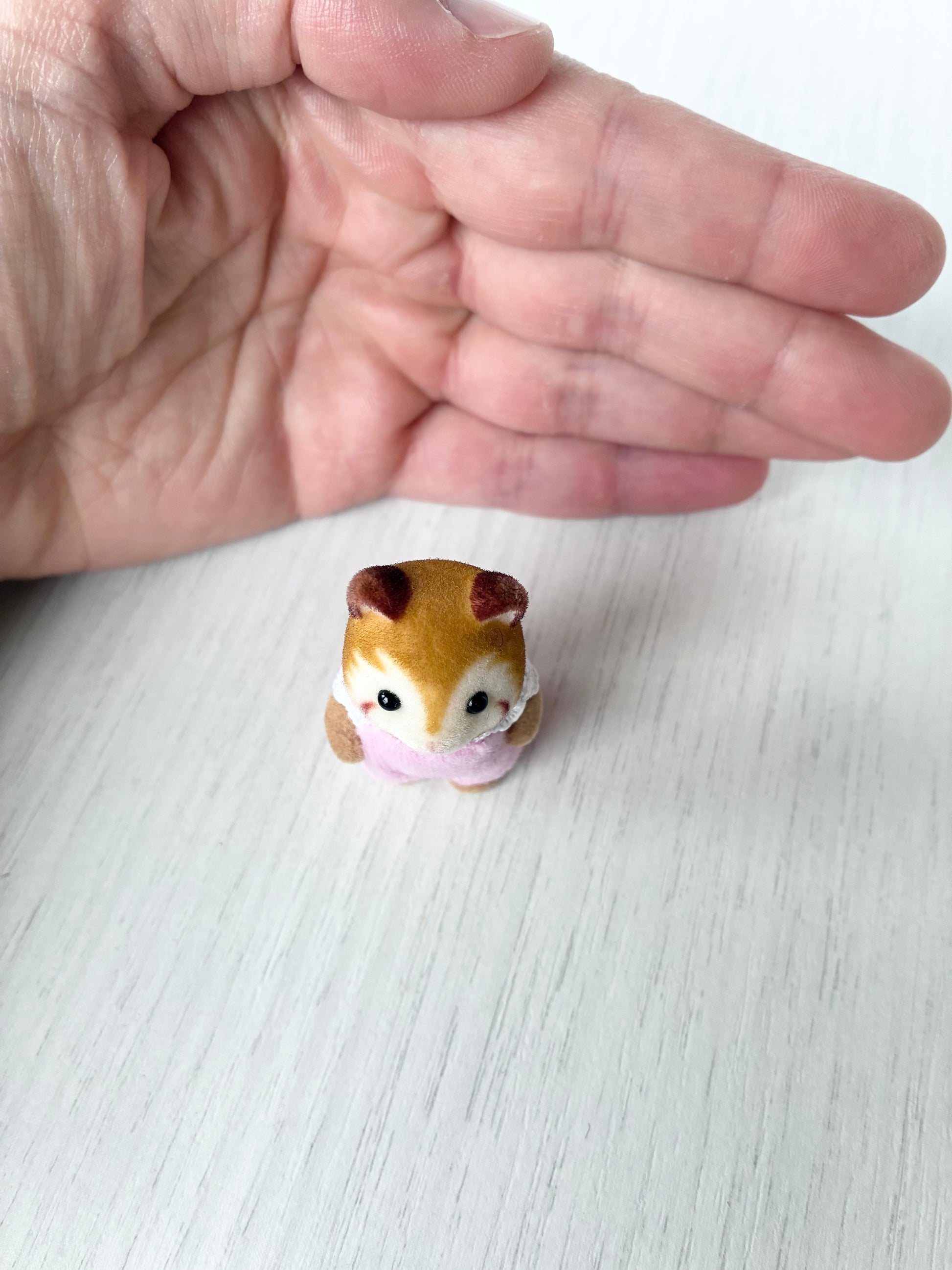 Calico Critters Sylvanian Families red panda baby figure, front view