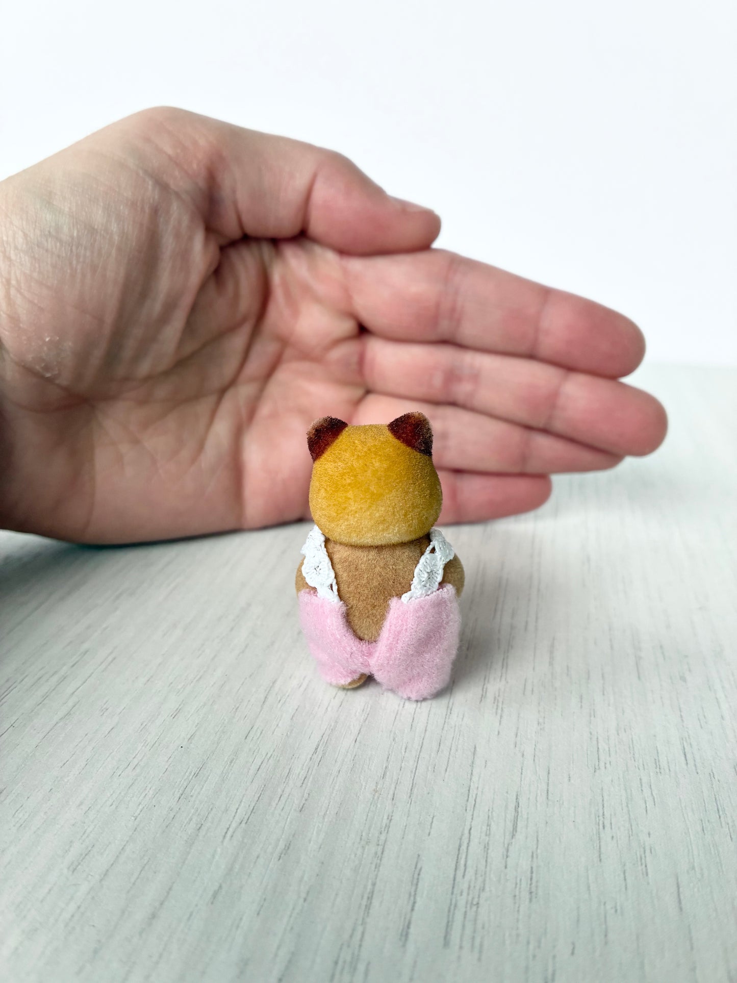 Back view of Calico Critters Sylvanian Families red panda baby