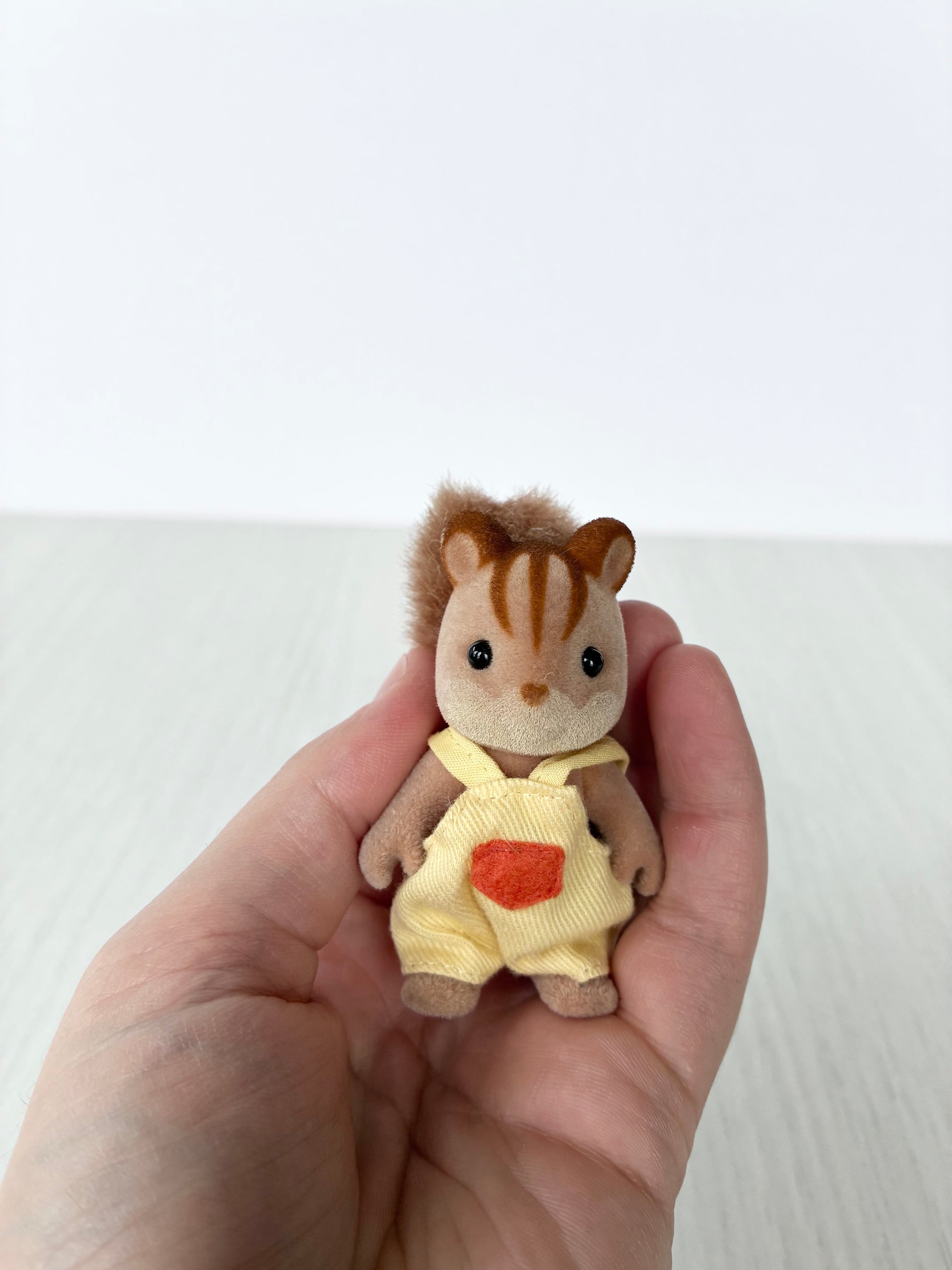 Calico Critters Sylvanian Families squirrel baby boy in yellow romper with acorn