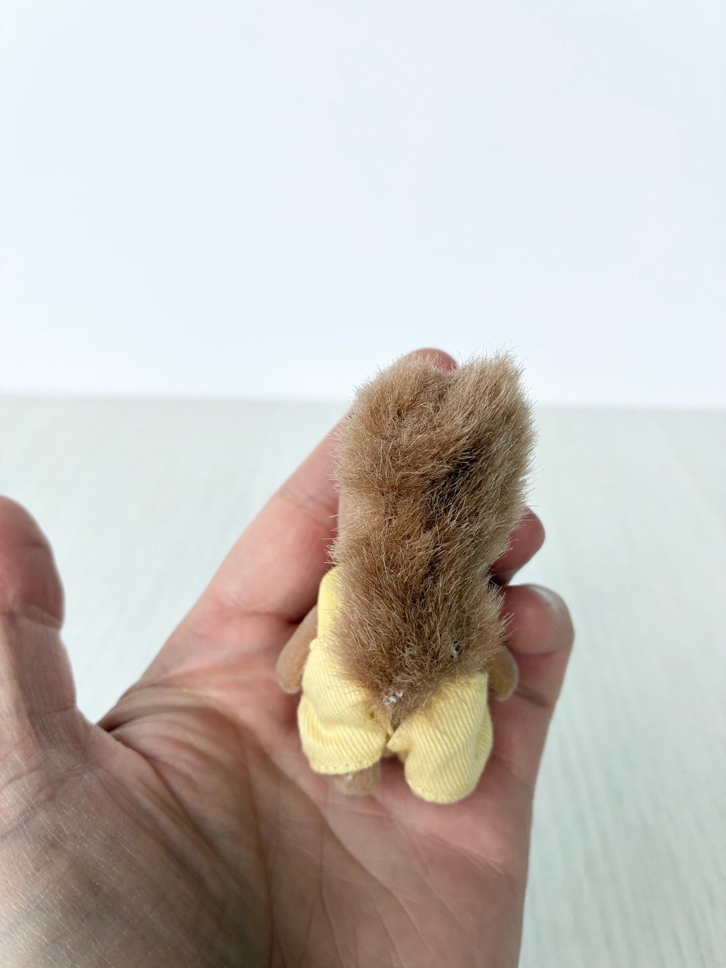 Back view of Calico Critters Sylvanian Families squirrel baby showing bushy tail
