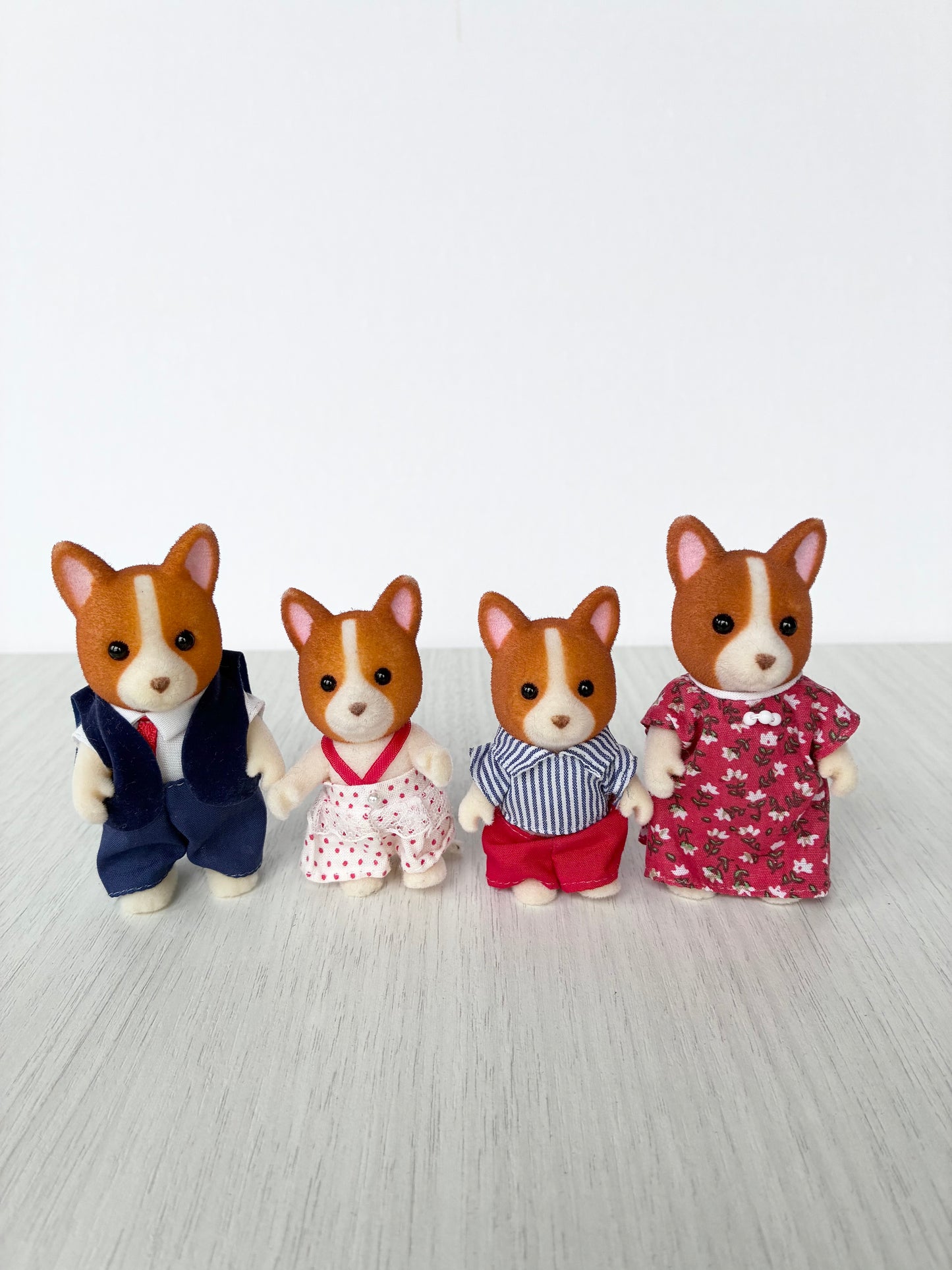 Calico Critters Sylvanian Families corgi dog family of four figures standing together