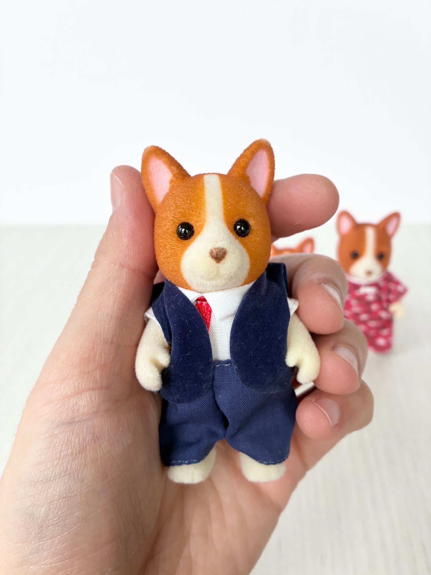 Calico Critters Sylvanian Families corgi father figure in navy waistcoat and red tie