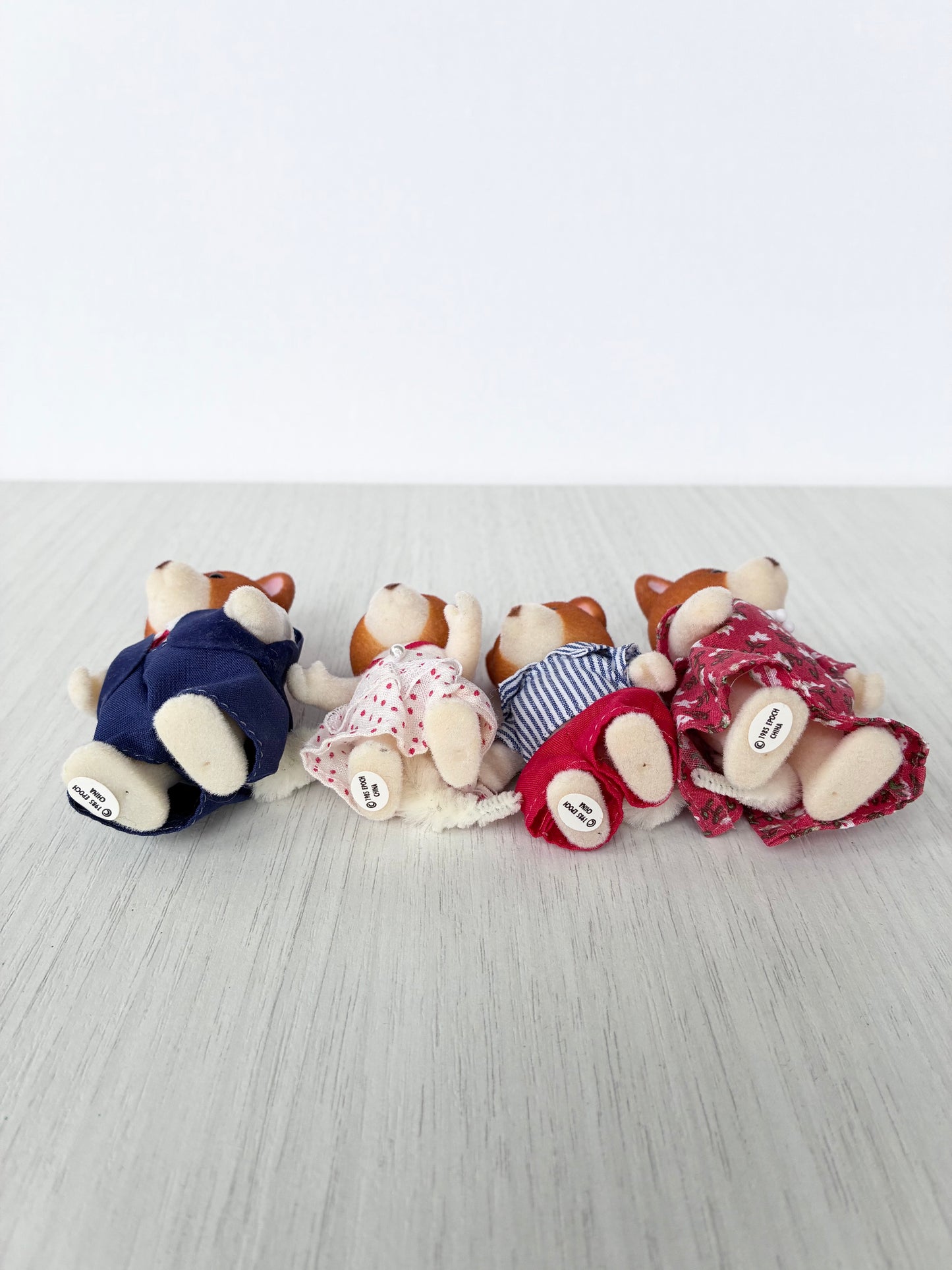 Calico Critters Sylvanian Families corgi family shown from behind