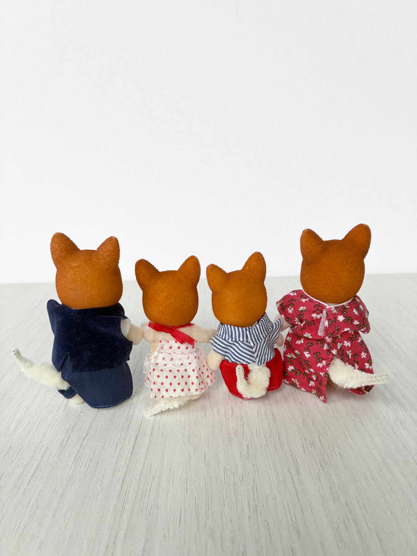 Back view of Calico Critters Sylvanian Families corgi family of four