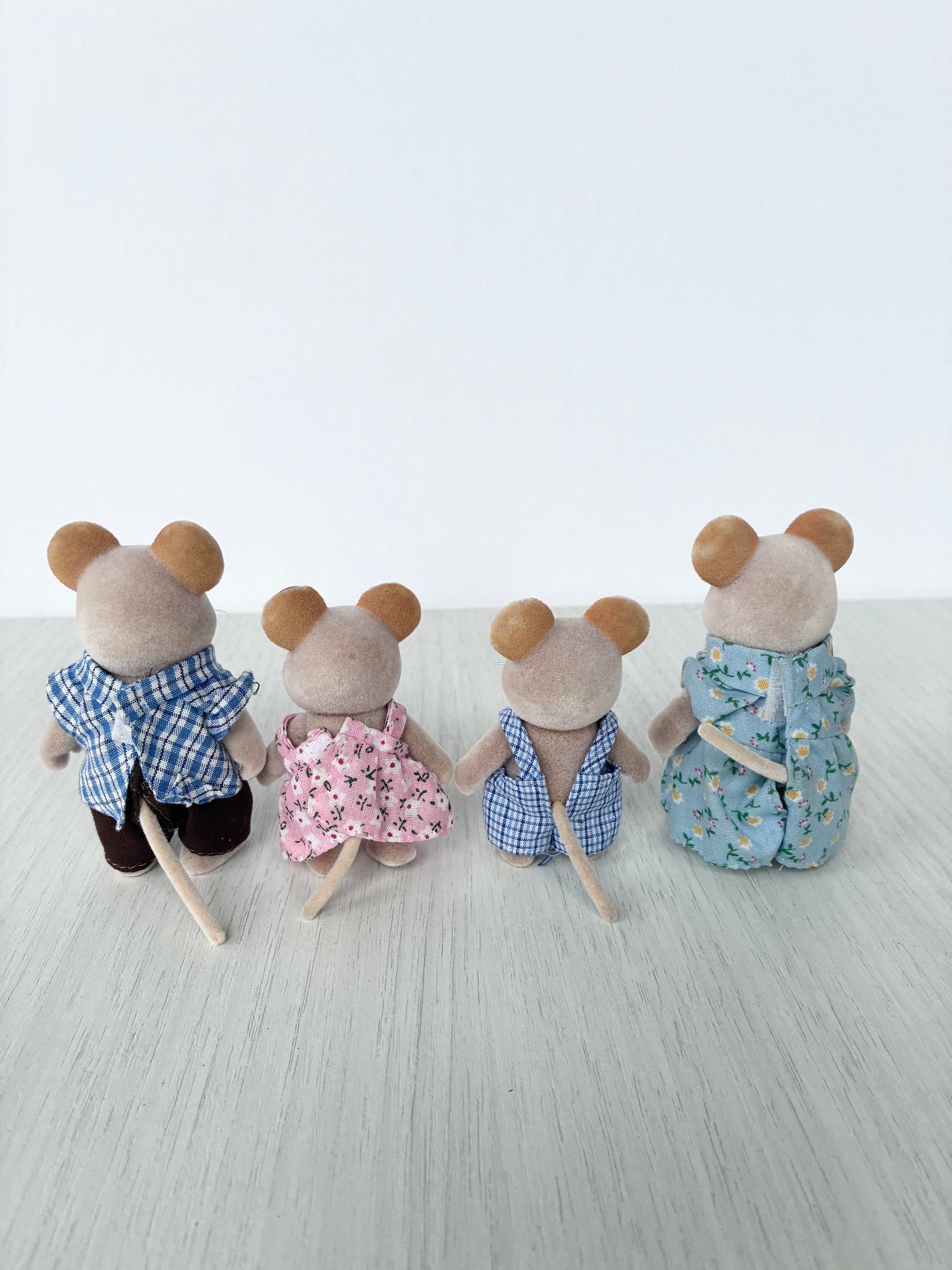 Calico Critters Sylvanian Families mouse family shown from behind