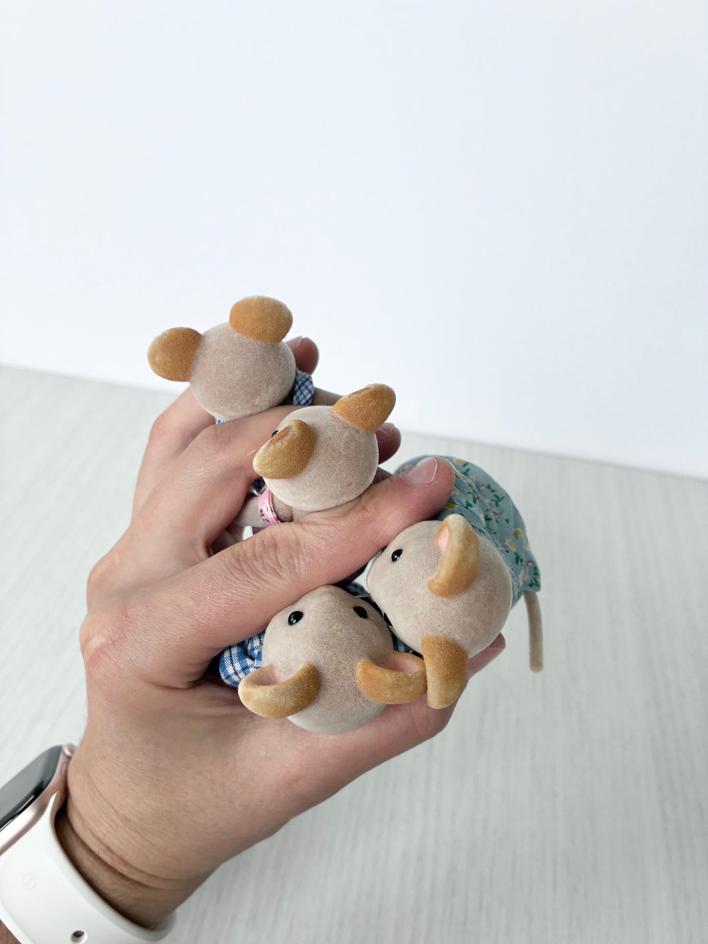 Calico Critters Sylvanian Families mouse figures held in hand for scale