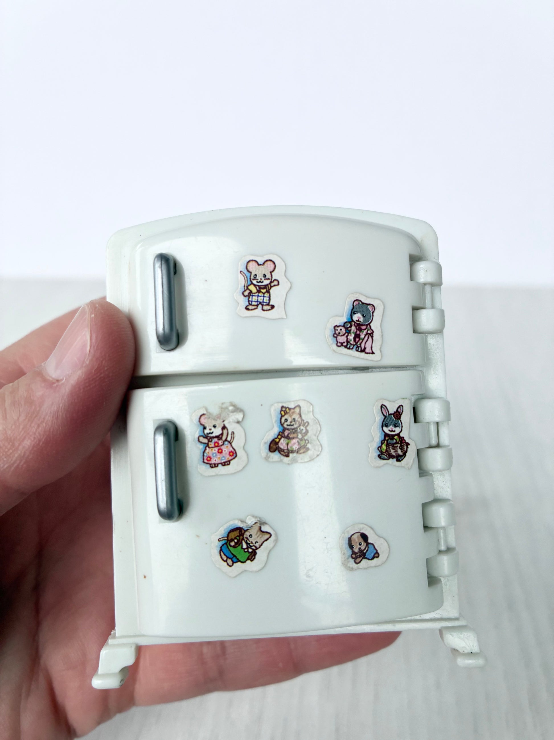 Calico Critters Sylvanian Families fridge front decorated with animal stickers