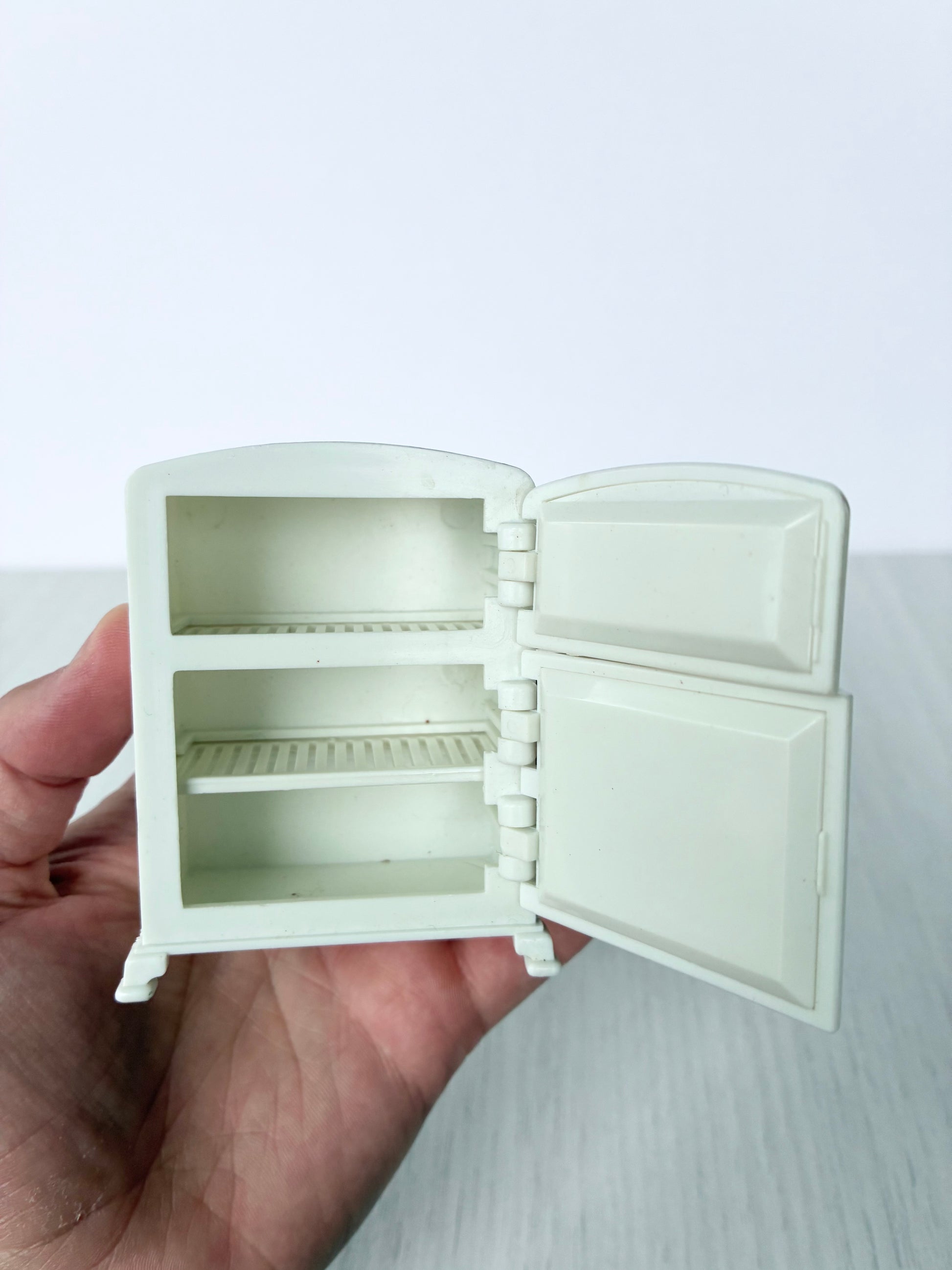 Calico Critters Sylvanian Families refrigerator with doors open showing shelves