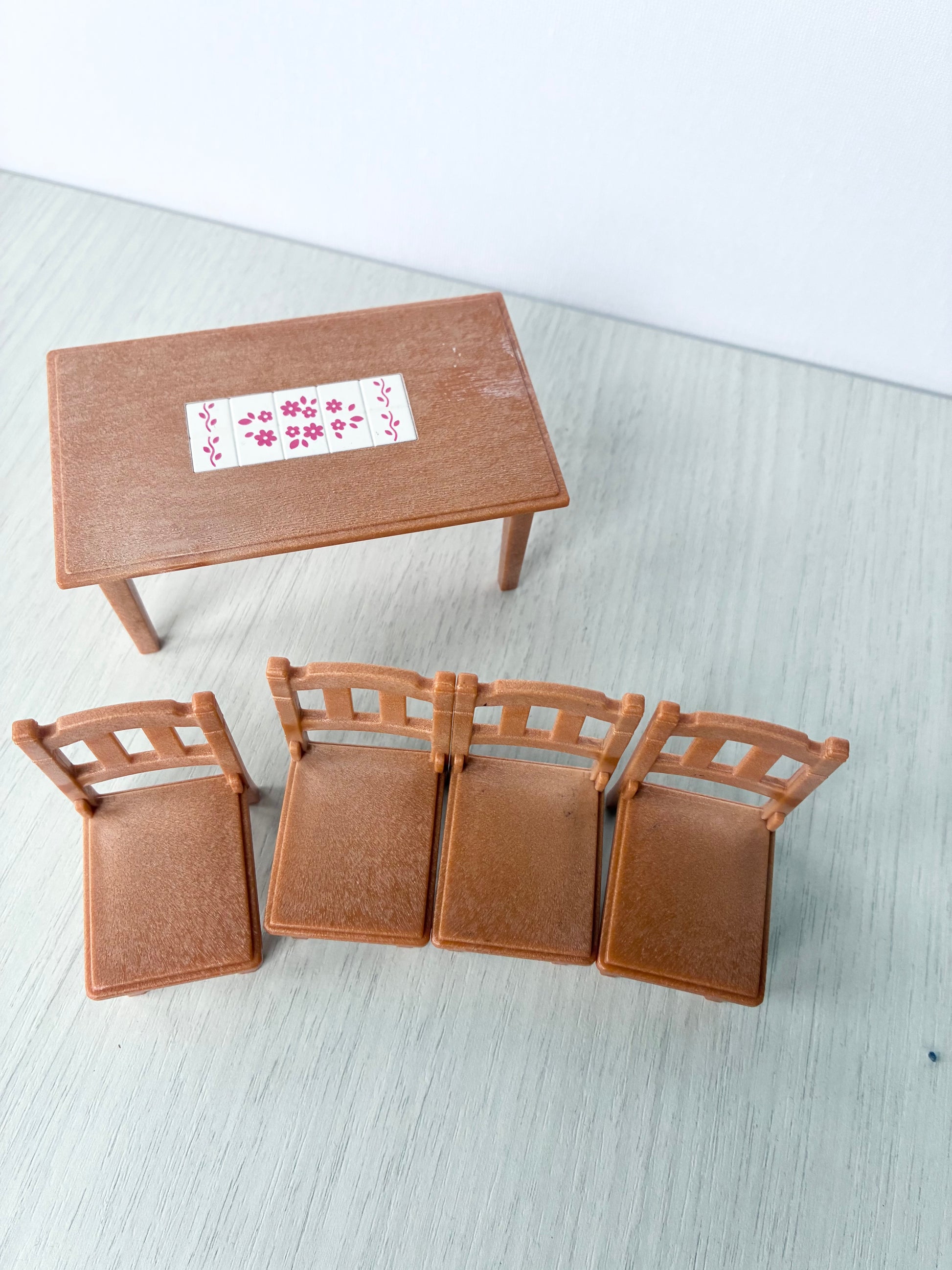 Close view of Calico Critters Sylvanian Families dollhouse dining chairs