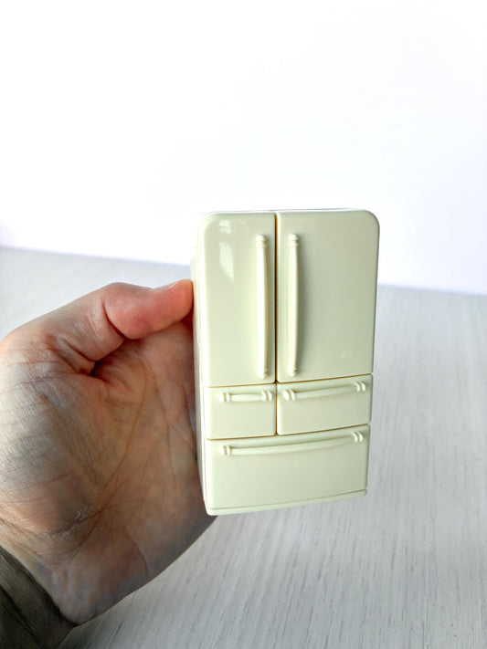 Miniature dollhouse fridge freezer, Calico Critters Kitchen Play Set, Sylvanian Families - closed front view held in hand
