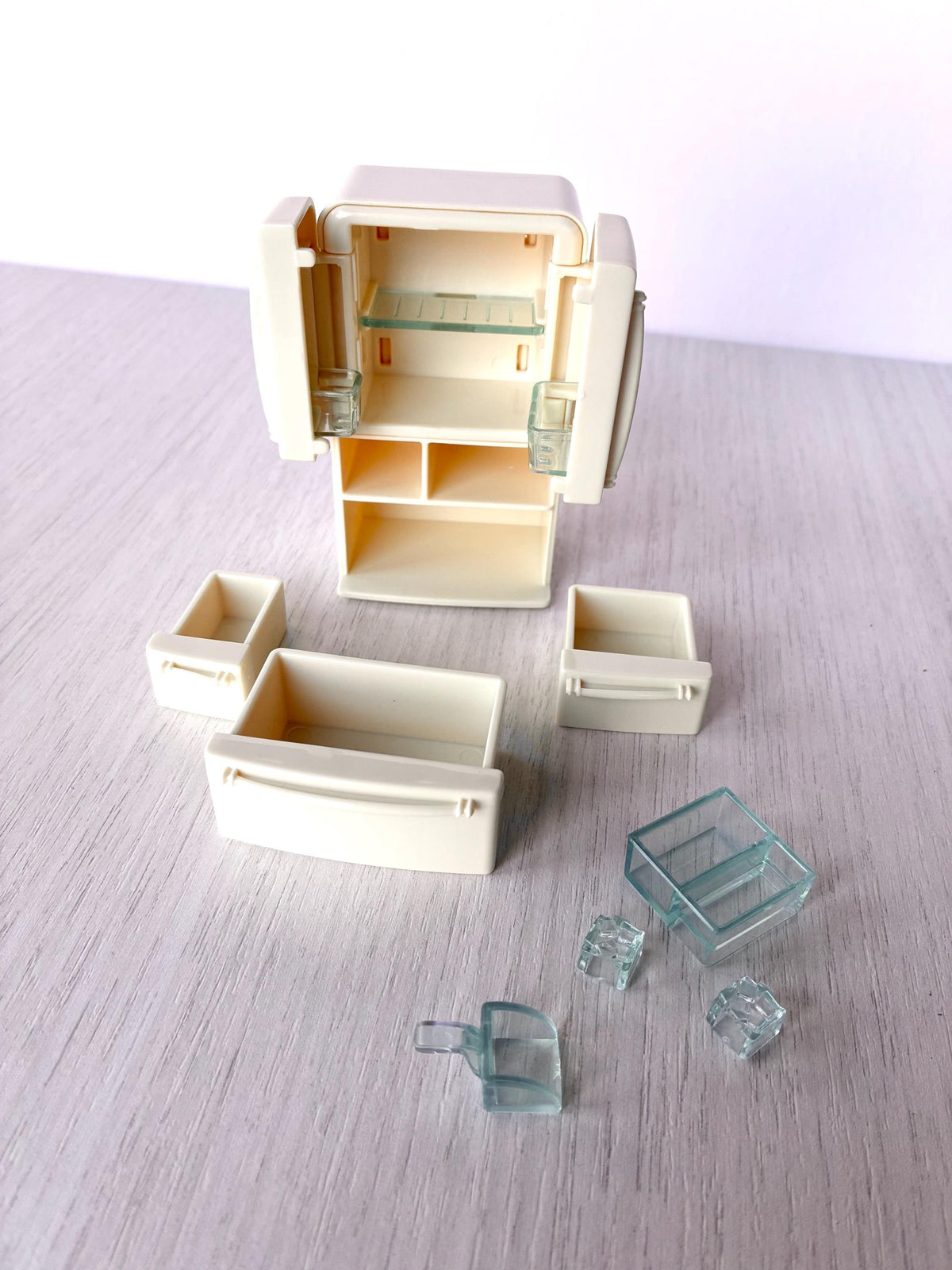Miniature dollhouse fridge freezer, Calico Critters Kitchen Play Set, Sylvanian Families - fridge with the three drawers, ice bucket and ice cubes laid out