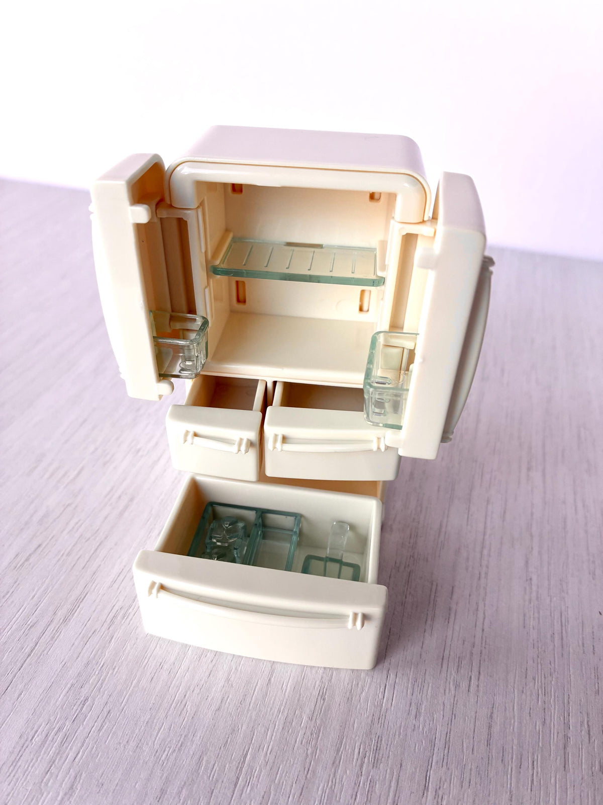 Miniature dollhouse fridge freezer, Calico Critters Kitchen Play Set, Sylvanian Families - doors open with the freezer drawer pulled out
