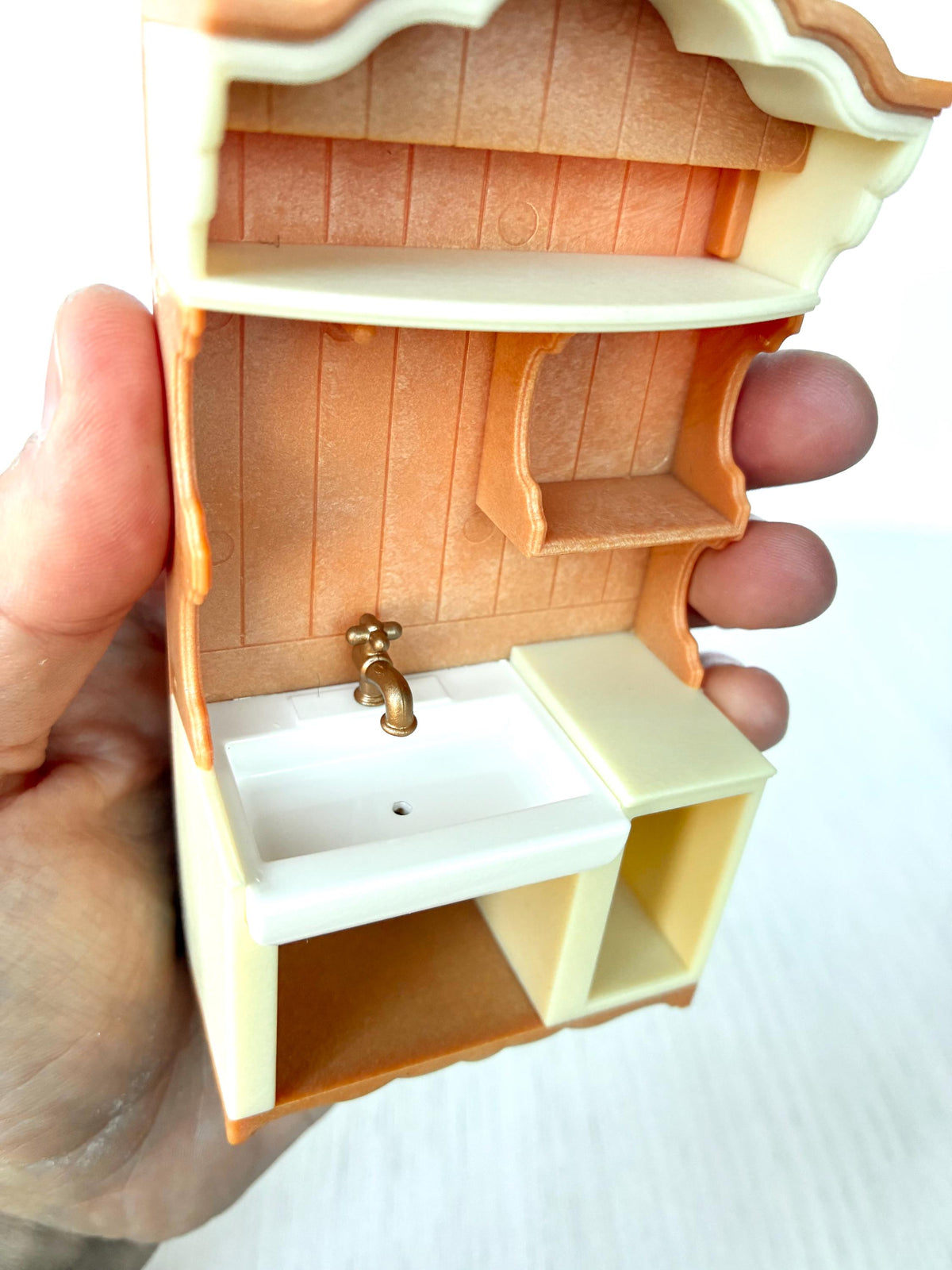 Miniature dollhouse kitchen sink unit, Calico Critters Kitchen Play Set, Sylvanian Families - close-up of the brass tap and sink basin