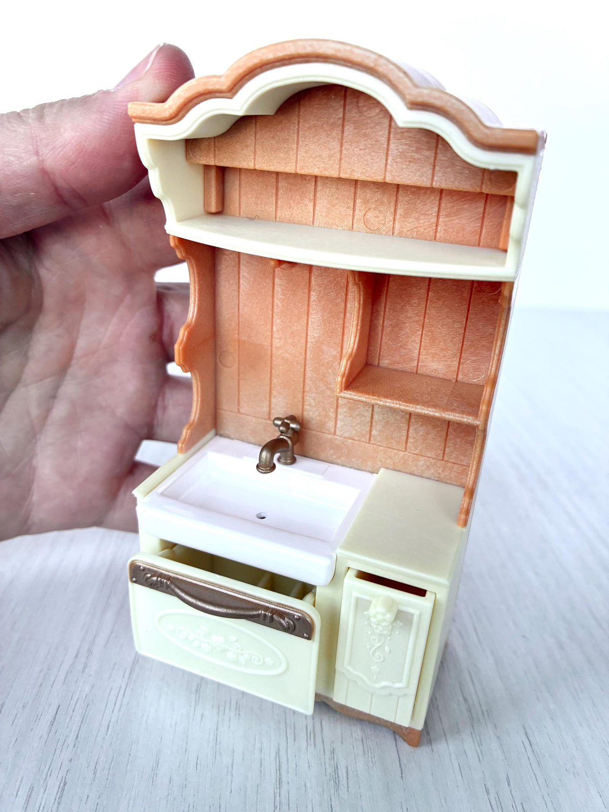 Miniature dollhouse kitchen sink unit, Calico Critters Kitchen Play Set, Sylvanian Families - close-up with the drawer and cupboard open
