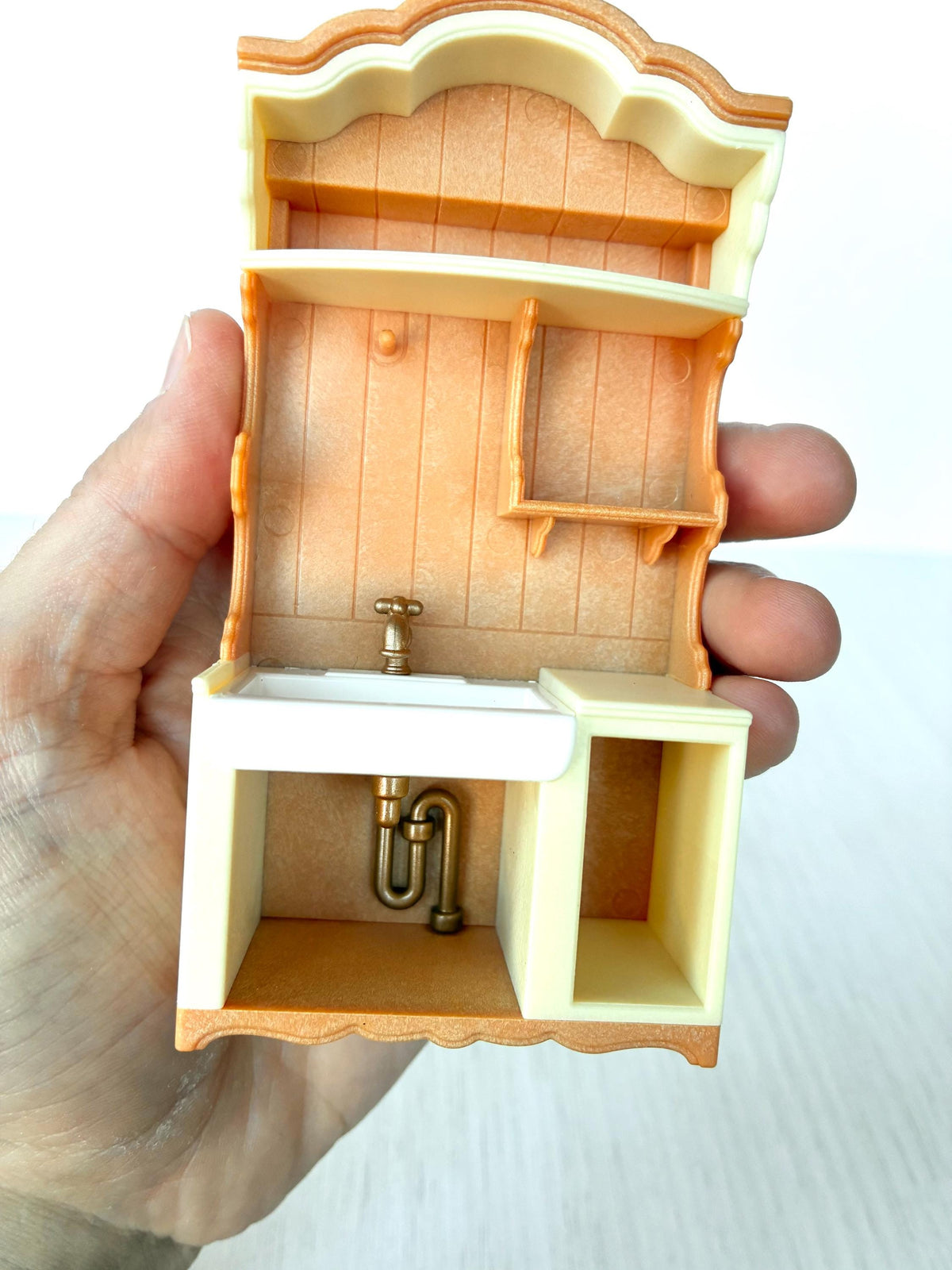 Miniature dollhouse kitchen sink unit, Calico Critters Kitchen Play Set, Sylvanian Families - sink basin lifted out showing the pipe underneath
