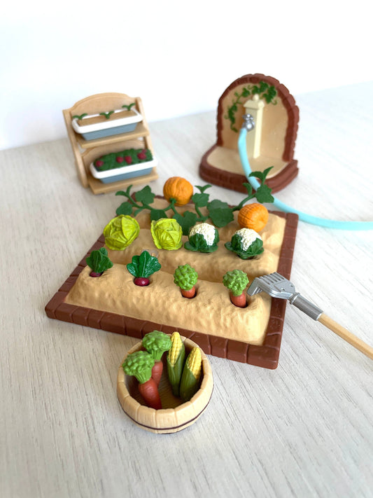 sylvanian families vintage vegetable garden set complete with garden bed, vegetables, rake, vegetable pots, hose, beds, corn, carrots, pumpkins, cabbage, cauliflower,raddish, and more.