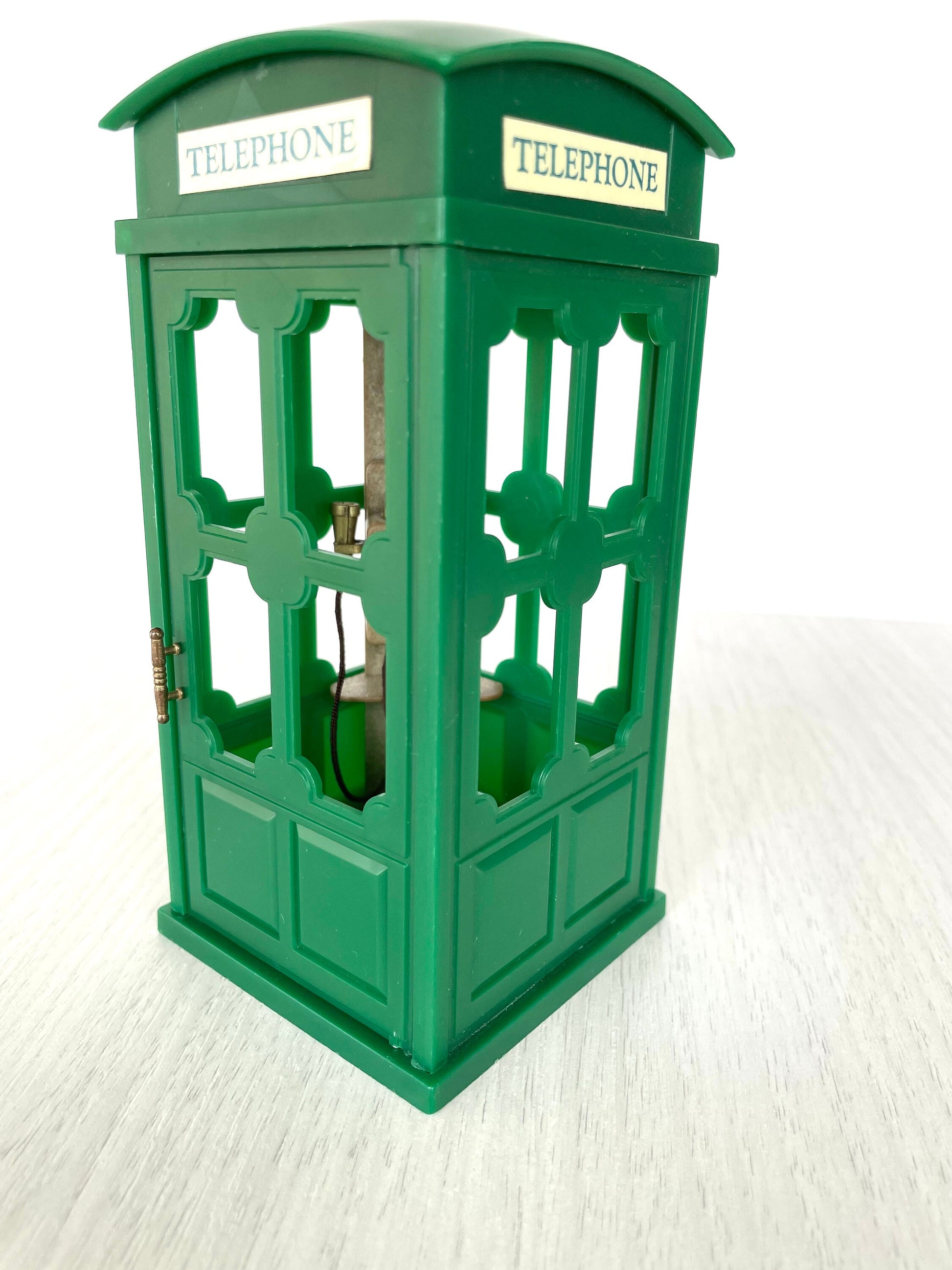 Green phone booth with original telephone stickers — vintage Sylvanian Families / Calico Critters