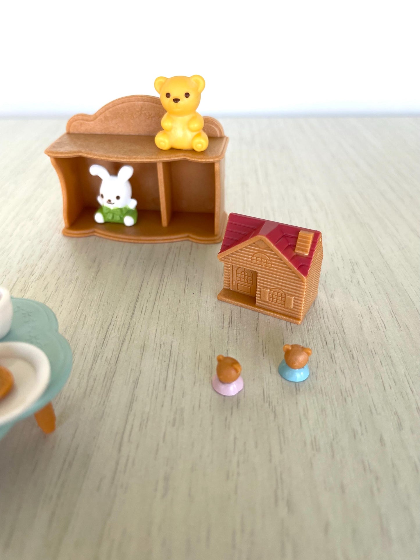Calico Critters baby toys and tea party set with mini toy house, tea cups and kettle, cookies, little blue table, bookshelf, toy stuffies — Sylvanian Families