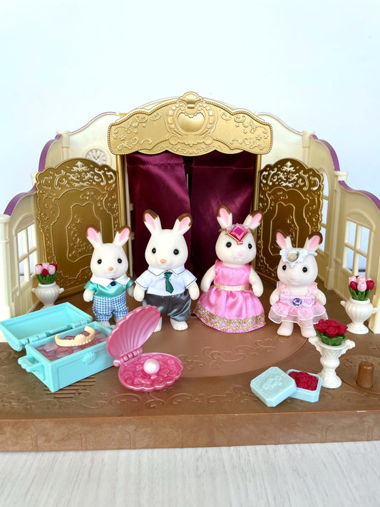 Ballet Theatre customized with Calico Critters accessories and figurines, building in excellent condition with rotating stage and hopscotch rabbits in dance costumes with ocean props and flowers.  Gold details on the building and red satin curtains.