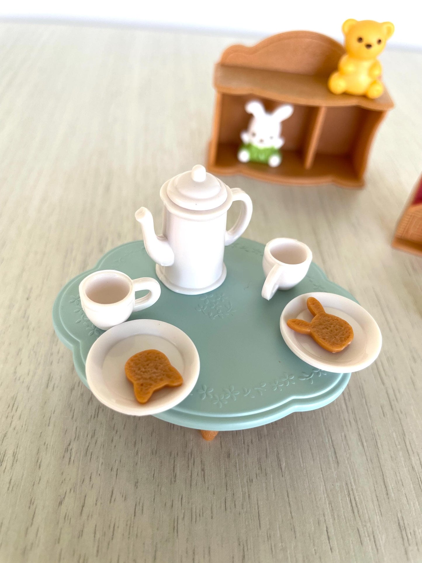 Calico Critters baby toys and tea party set with mini toy house, tea cups and kettle, cookies, little blue table, bookshelf, toy stuffies — Sylvanian Families
