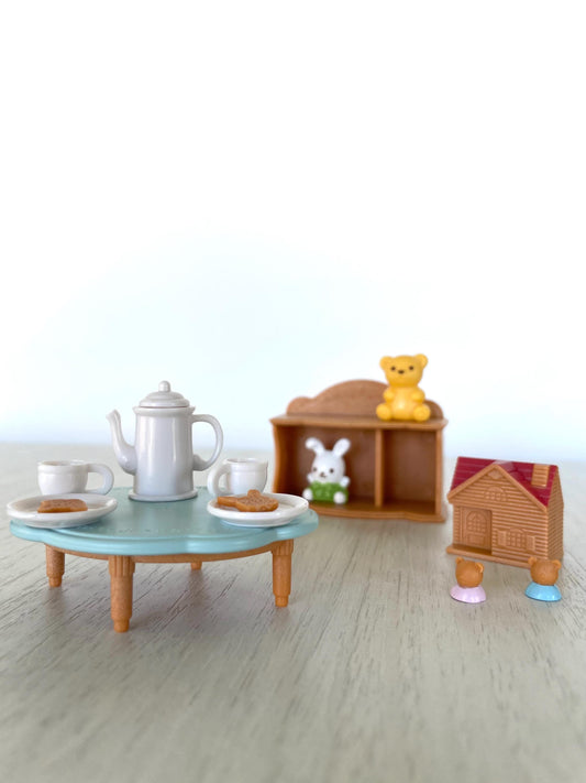 Calico Critters baby toys and tea party set with mini toy house, tea cups and kettle, cookies, little blue table, bookshelf, toy stuffies