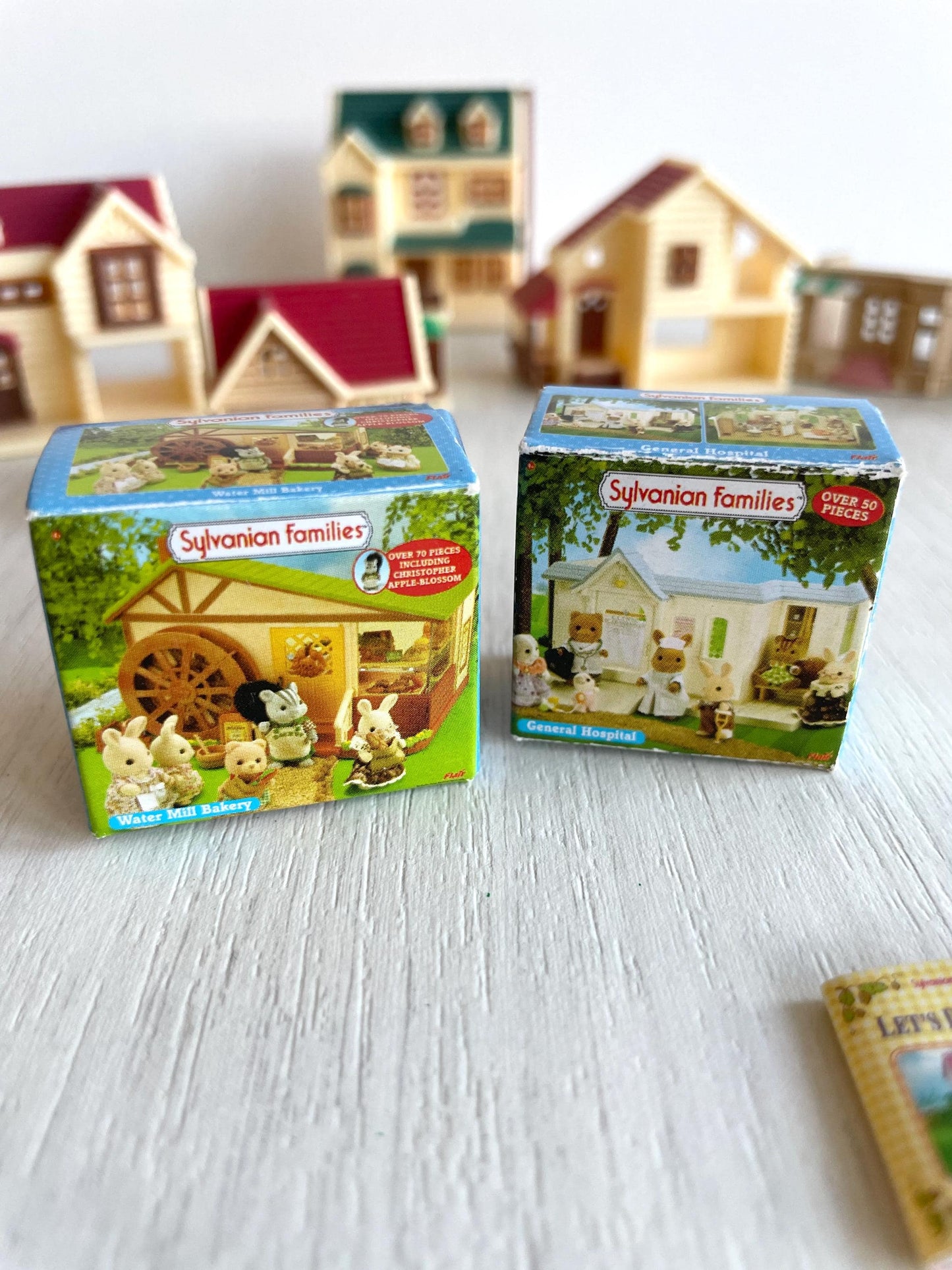 Miniature dollhouse replacement parts from vintage Sylvanian Toy Shop, Calico Critters tiny dollhouses with toy boxes and magazines