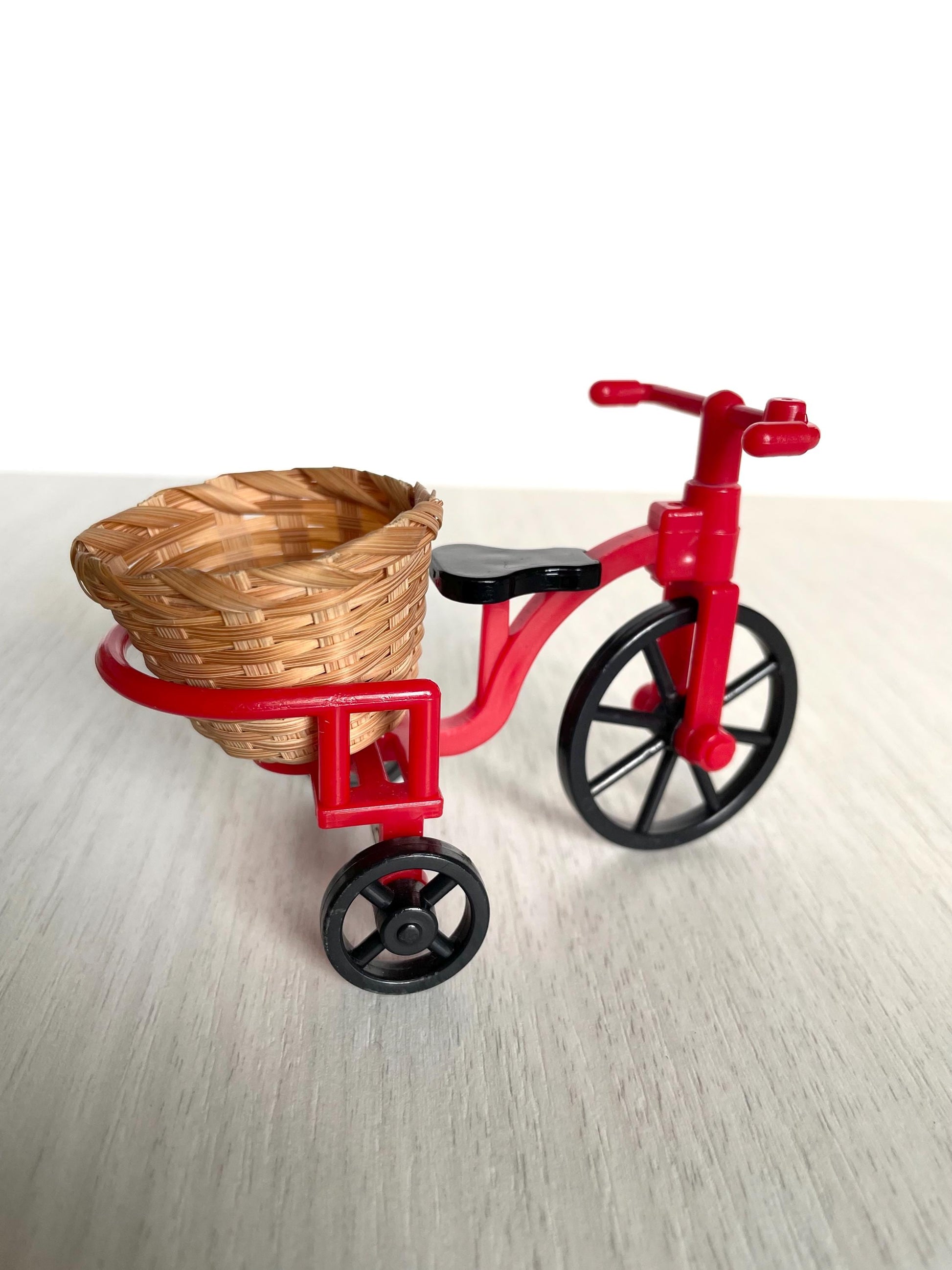 Vintage Sylvanian red bicycle with wicker basket, Calico Critters Collector's item from the United Kingdom. Tricycle