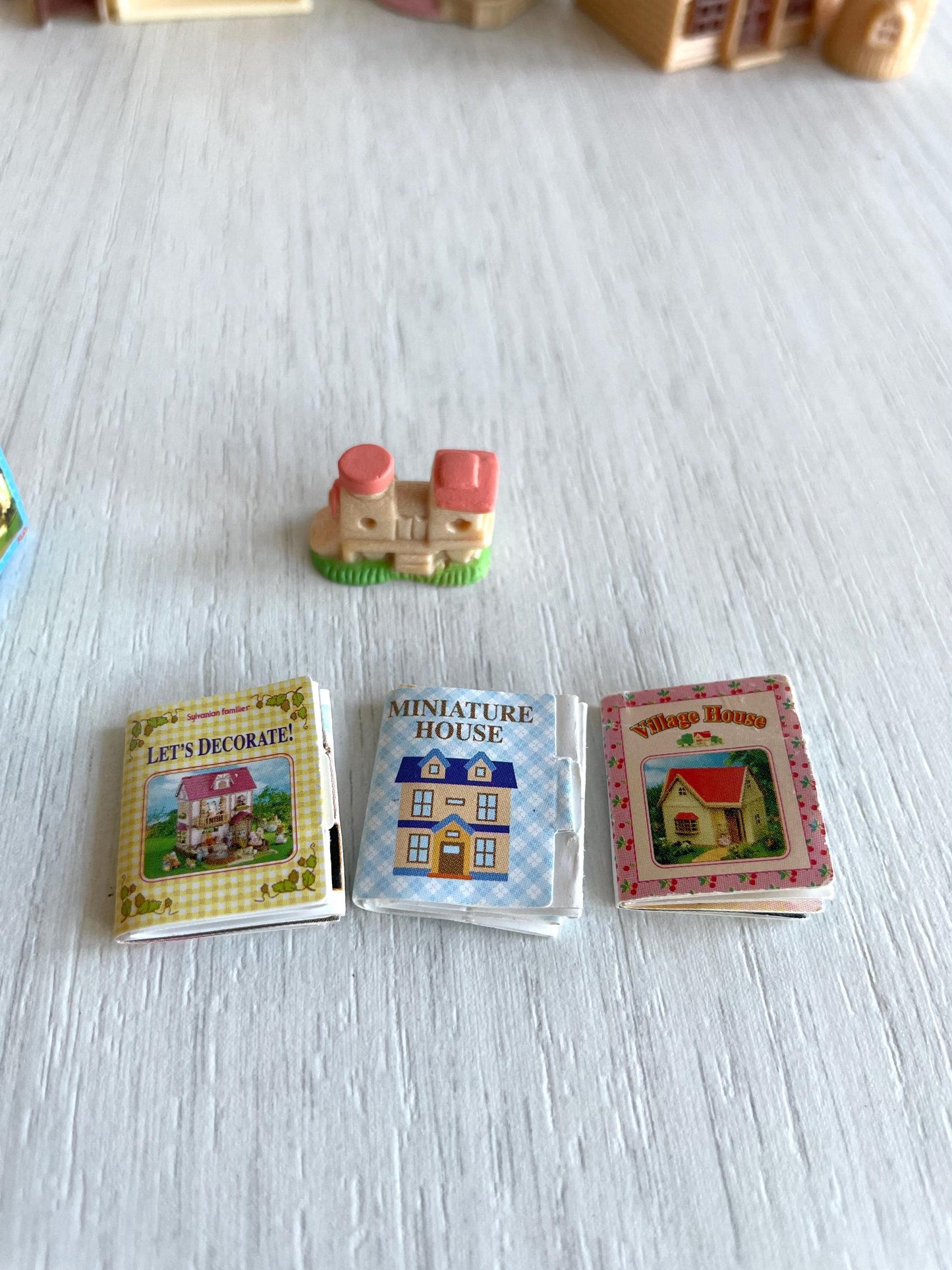 Miniature dollhouse replacement parts from vintage Sylvanian Toy Shop, Calico Critters tiny dollhouses with toy boxes and magazines
