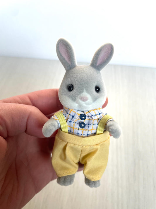 Calico Critters Cottontail Rabbit Dad is the perfect Easter gift! This adorable 3-inch collectible toy figure features soft, plush accents and is ideal for Easter baskets, springtime decor, or kids' play. A must-have for Calico Critters collectors, this bunny figure is part of the Cottontail Rabbit family. Add charm to your Easter celebrations with this cute and durable rabbit toy figure, perfect for young children and collectors alike