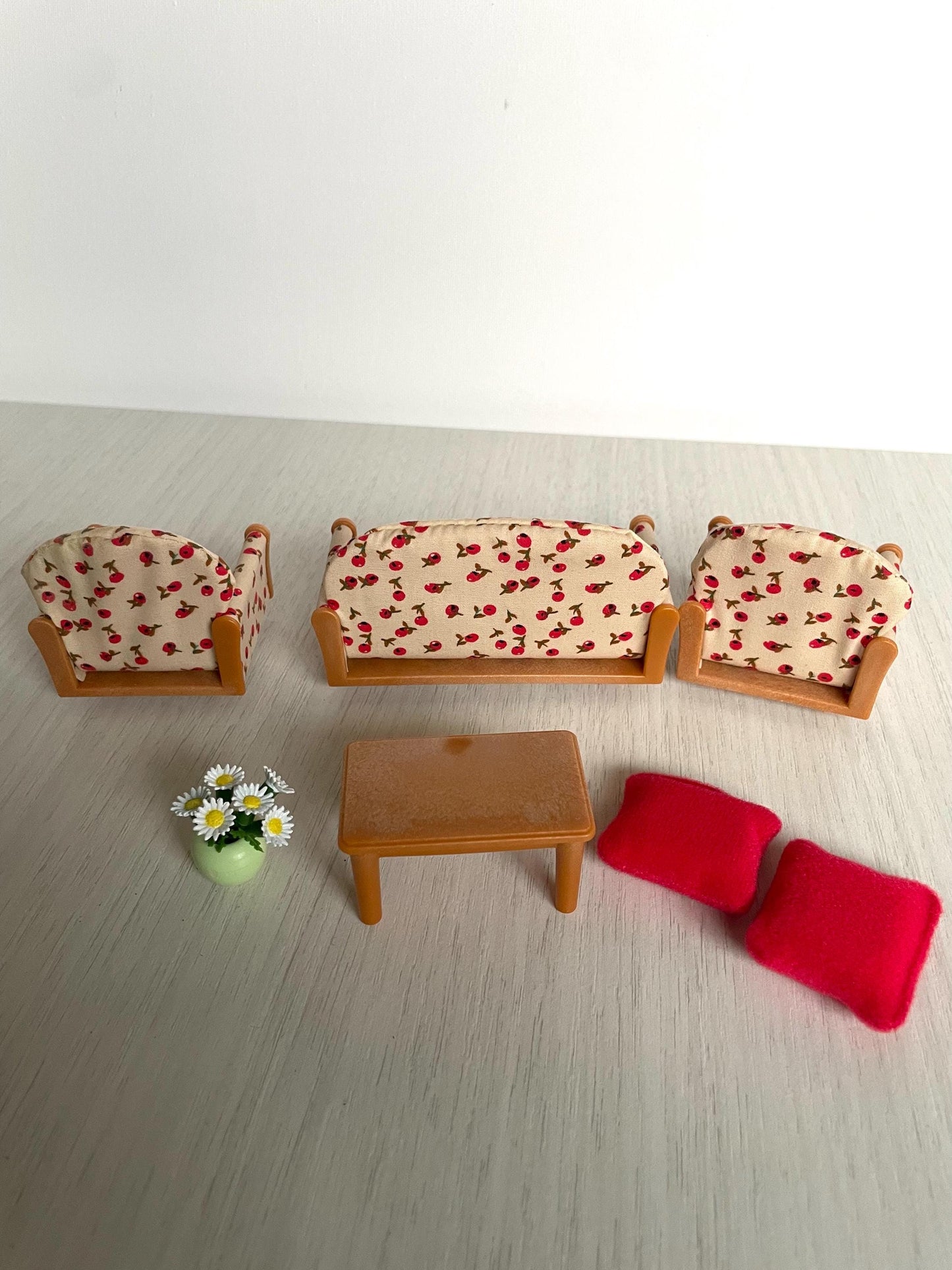 Calico Critters floral couch living room set with white flowers in vase and red pillows, Sylvanian Families couch and armchair set