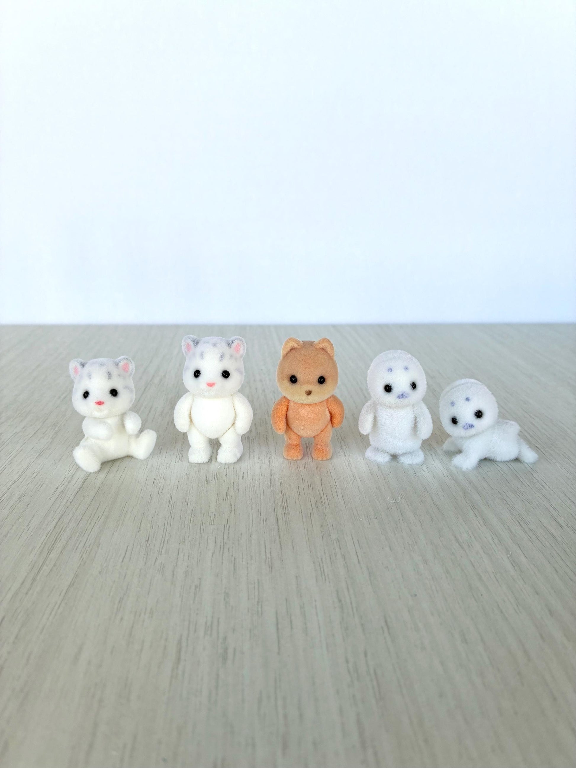Calico Critters snow leopard babies, seal baby, and caramel dog babies, pick one critter — Sylvanian Families