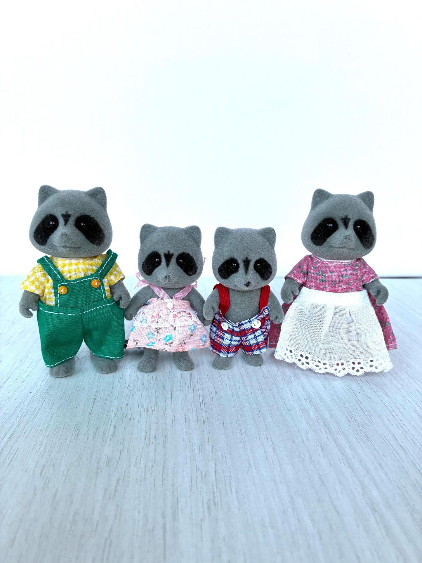 Vintage Sylvanian Families Chestnut Raccoon Family flocked figurines with gripping hands — Calico Critters collectible