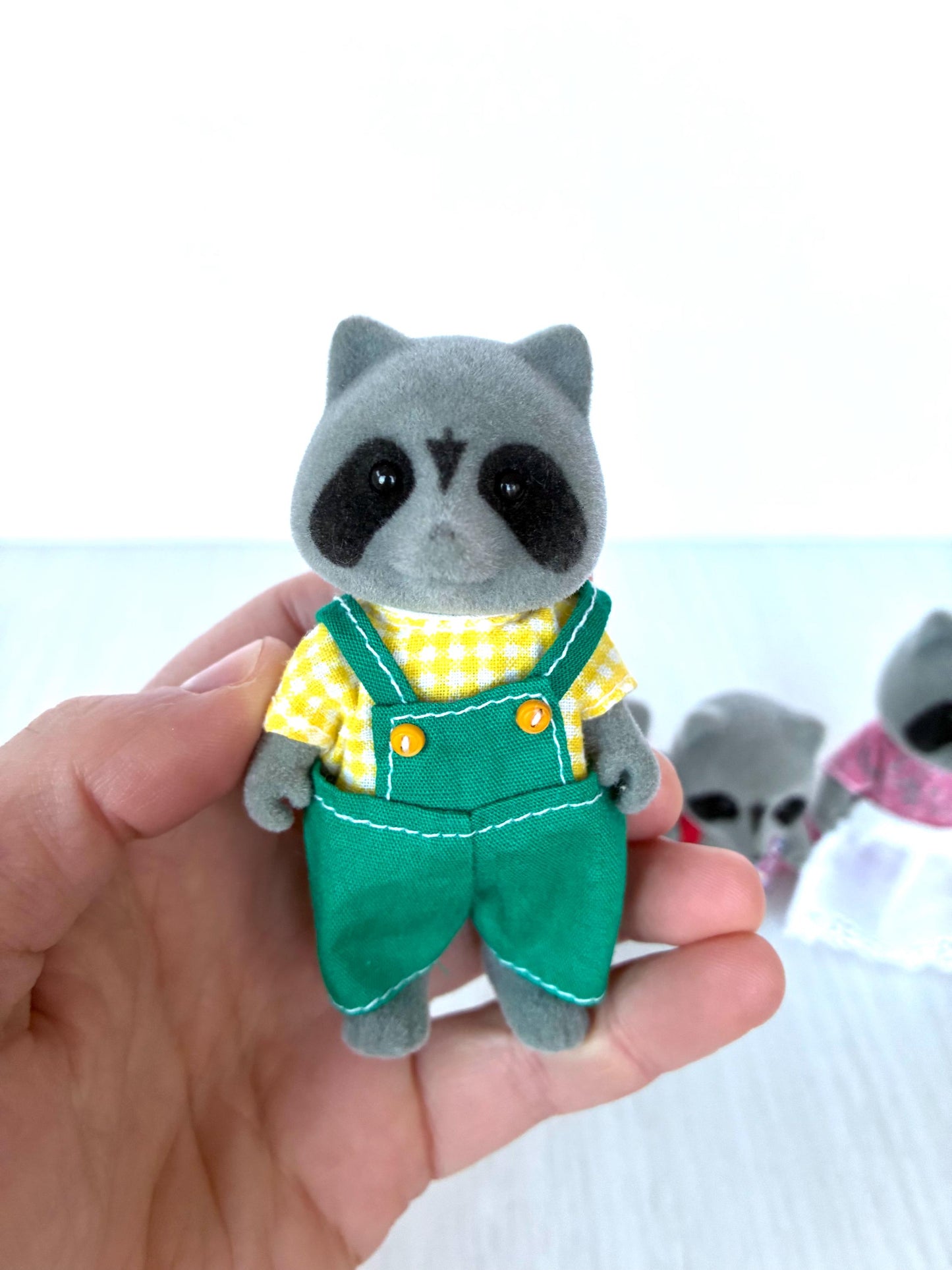 Sylvanian Families Chestnut Raccoon family in original clothing — vintage Calico Critters