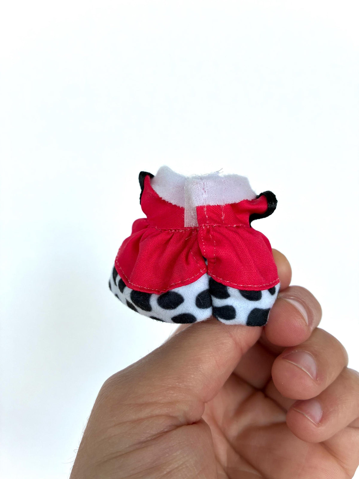 Back view of the Dalmatian polka dot child-size dress for Calico Critters and Sylvanian Families figures, showing the red bodice and spotted skirt.