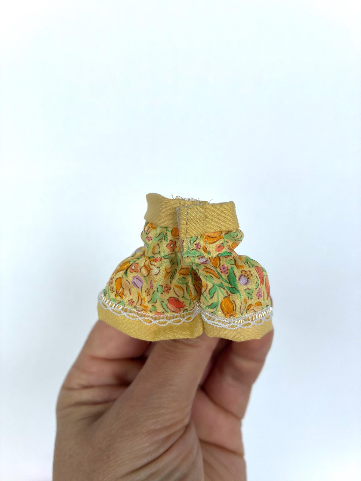 Back view of the yellow floral child-size dress for Calico Critters and Sylvanian Families figures.