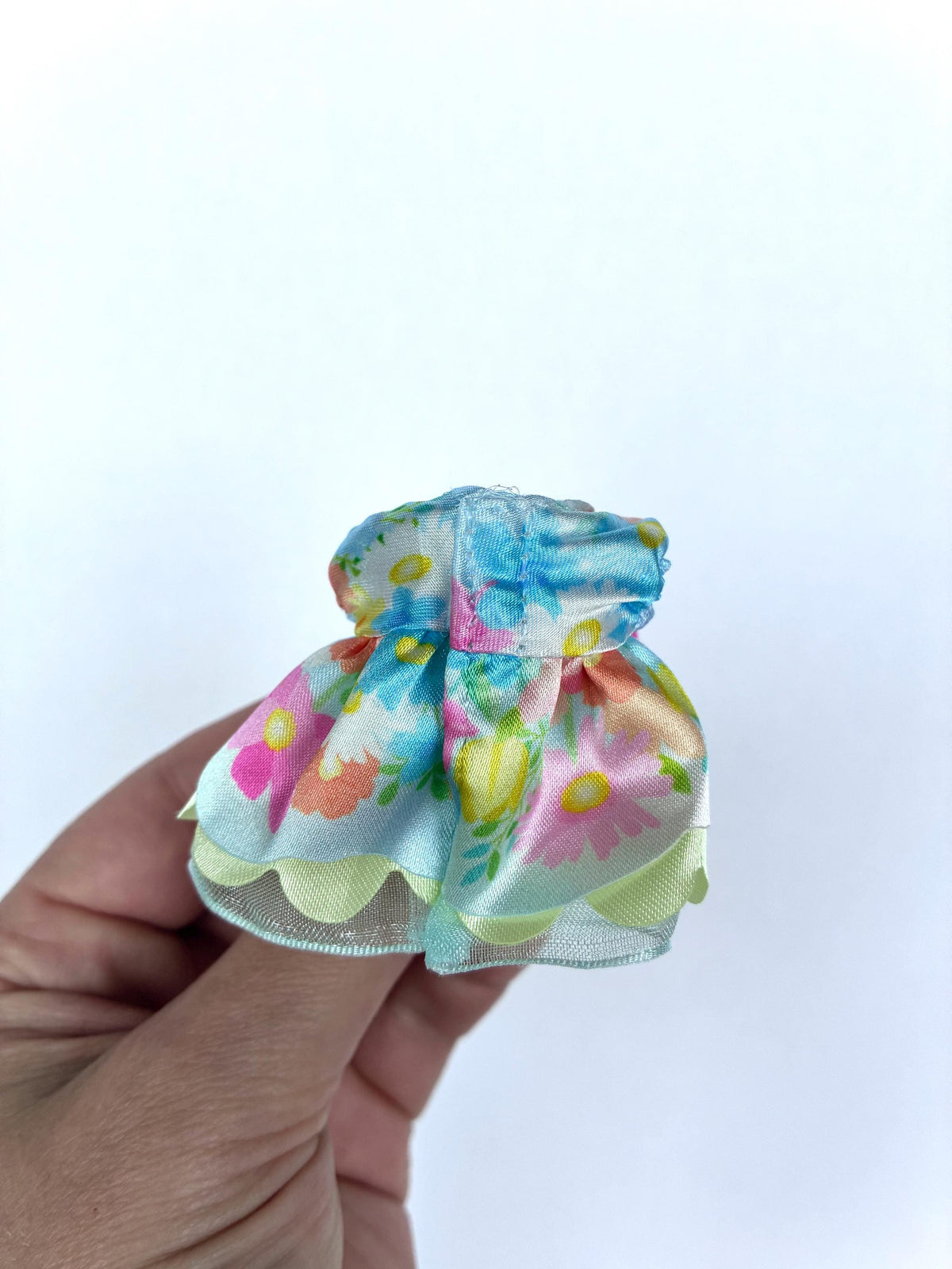 Back view of the pastel floral Flowering Princess ruffle dress for child-size Calico Critters and Sylvanian Families figures.
