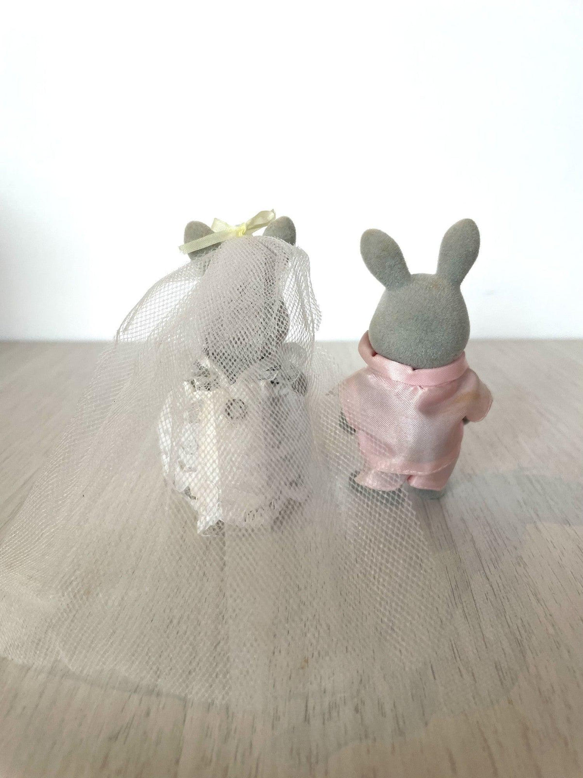 Back view of the vintage bride and groom rabbits showing the veil and suit detail — Calico Critters and Sylvanian Families