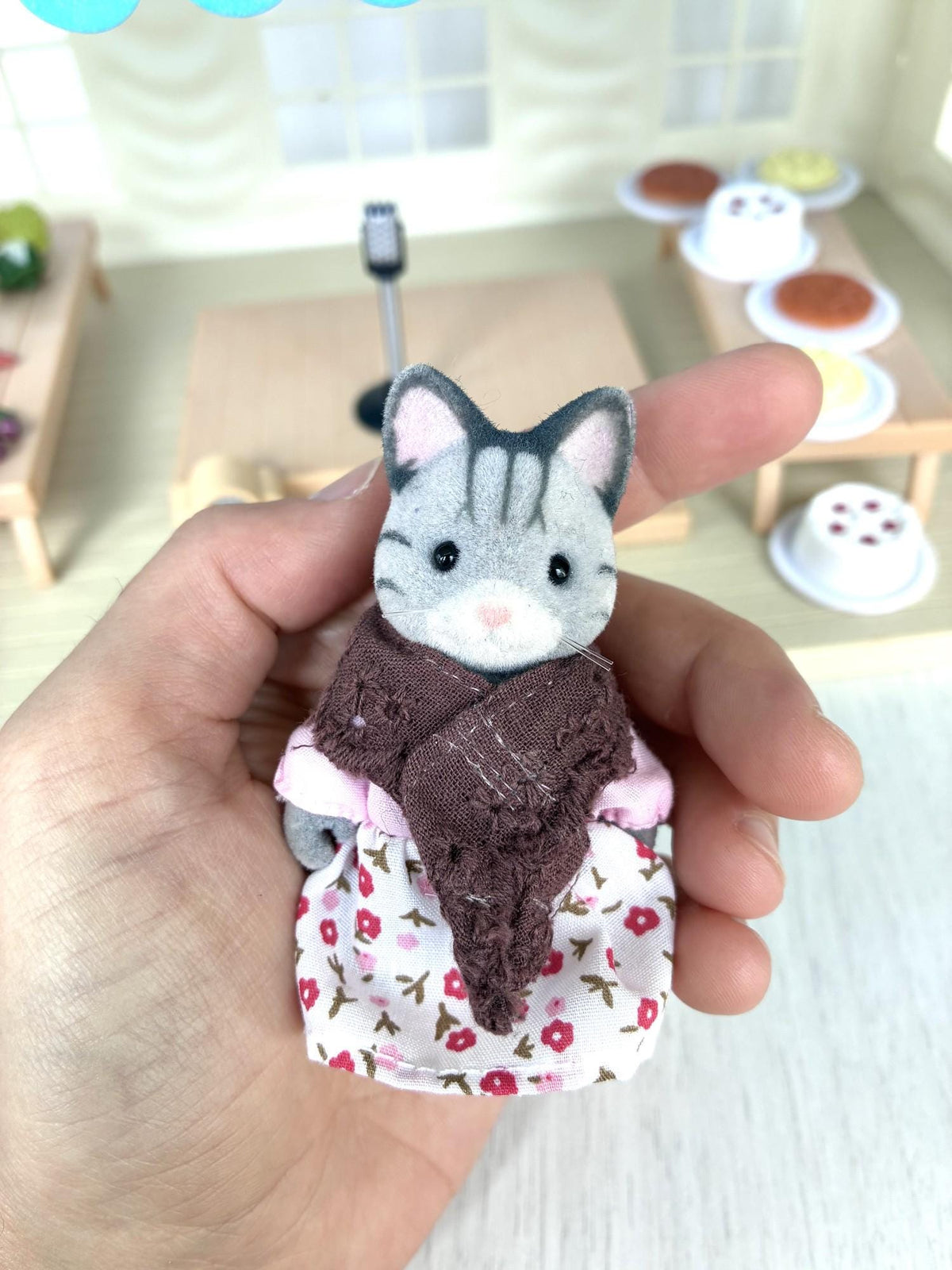 Calico Critters Sylvanian Families grey cat grandmother figure from the Marquee set in floral dress and brown shawl, held in hand