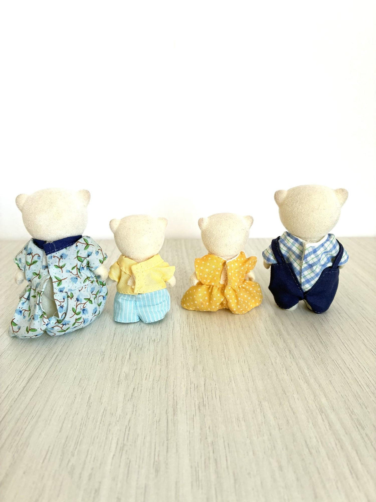 Calico Critters Sylvanian Families Beaufort Polar Bear Family side view showing original outfits