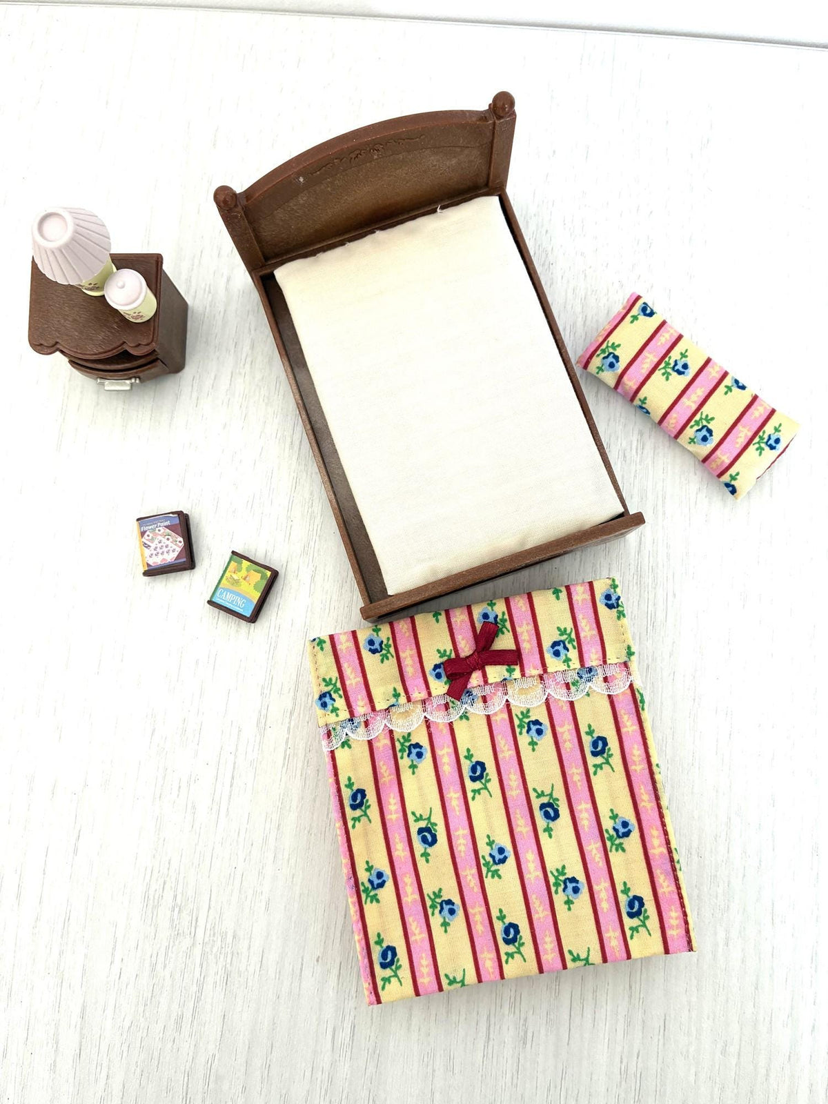 Calico Critters Sylvanian Families bed with mattress and quilt laid out separately